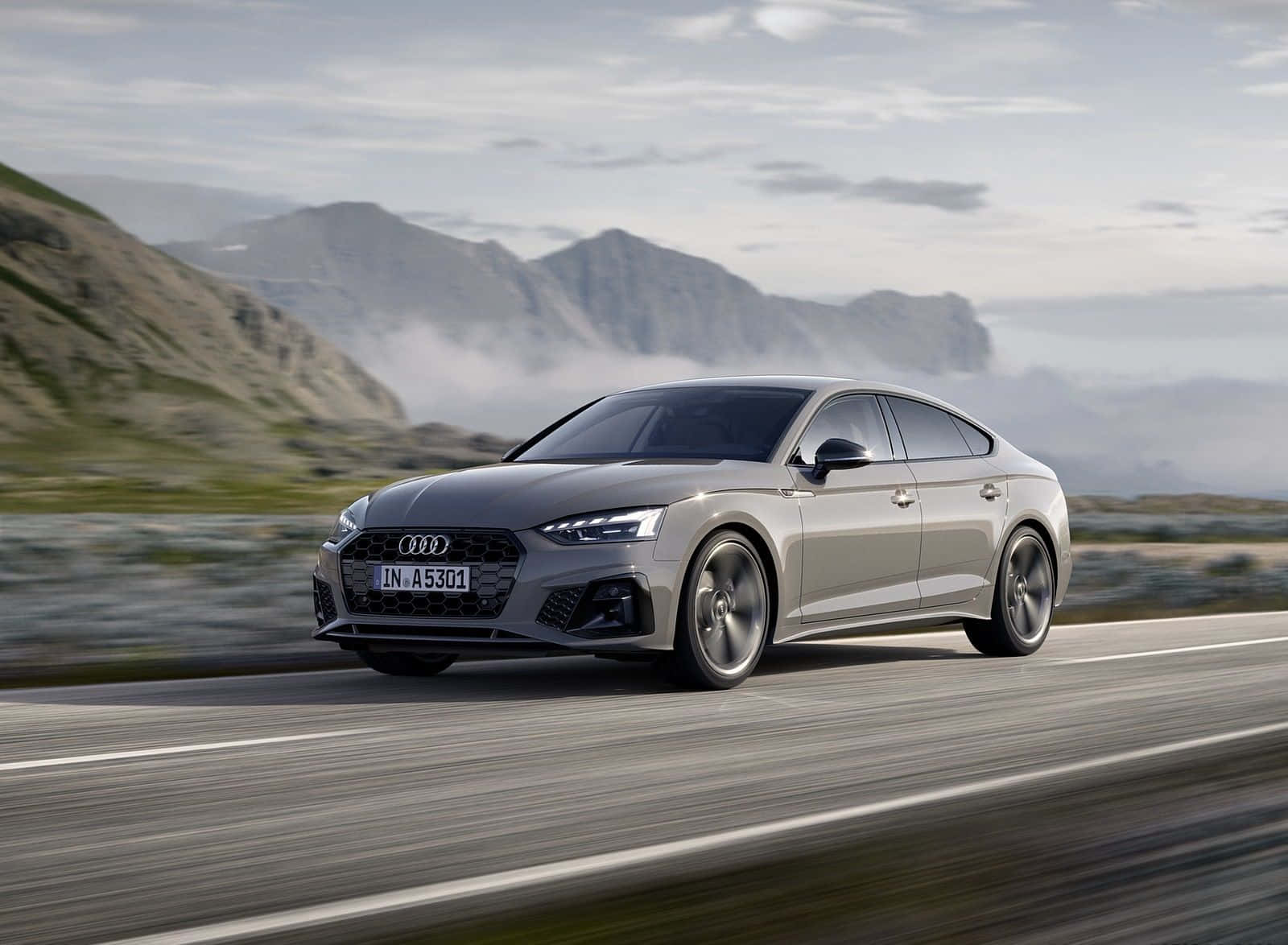 Sleek and Elegant Audi A5 in a Breathtaking Outdoor Setting Wallpaper