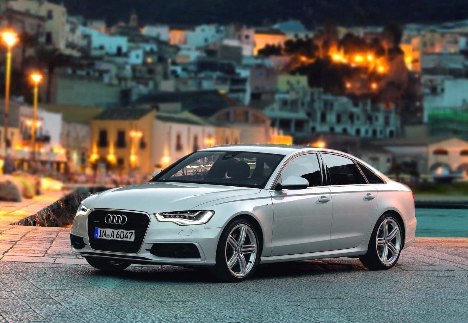 Sleek and Sophisticated Audi A6 in a Night Landscape Wallpaper