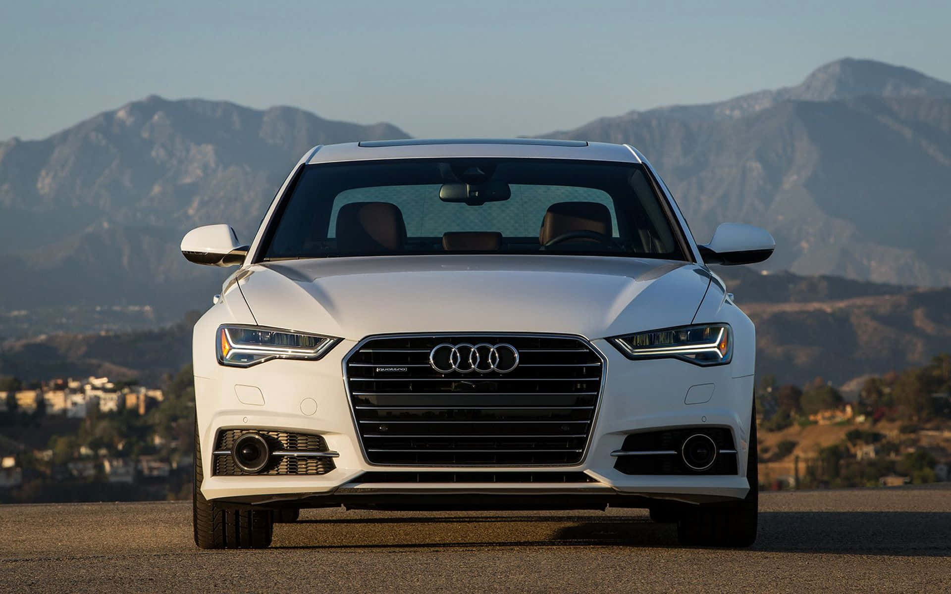 Stunning Audi A6 in motion on open road Wallpaper