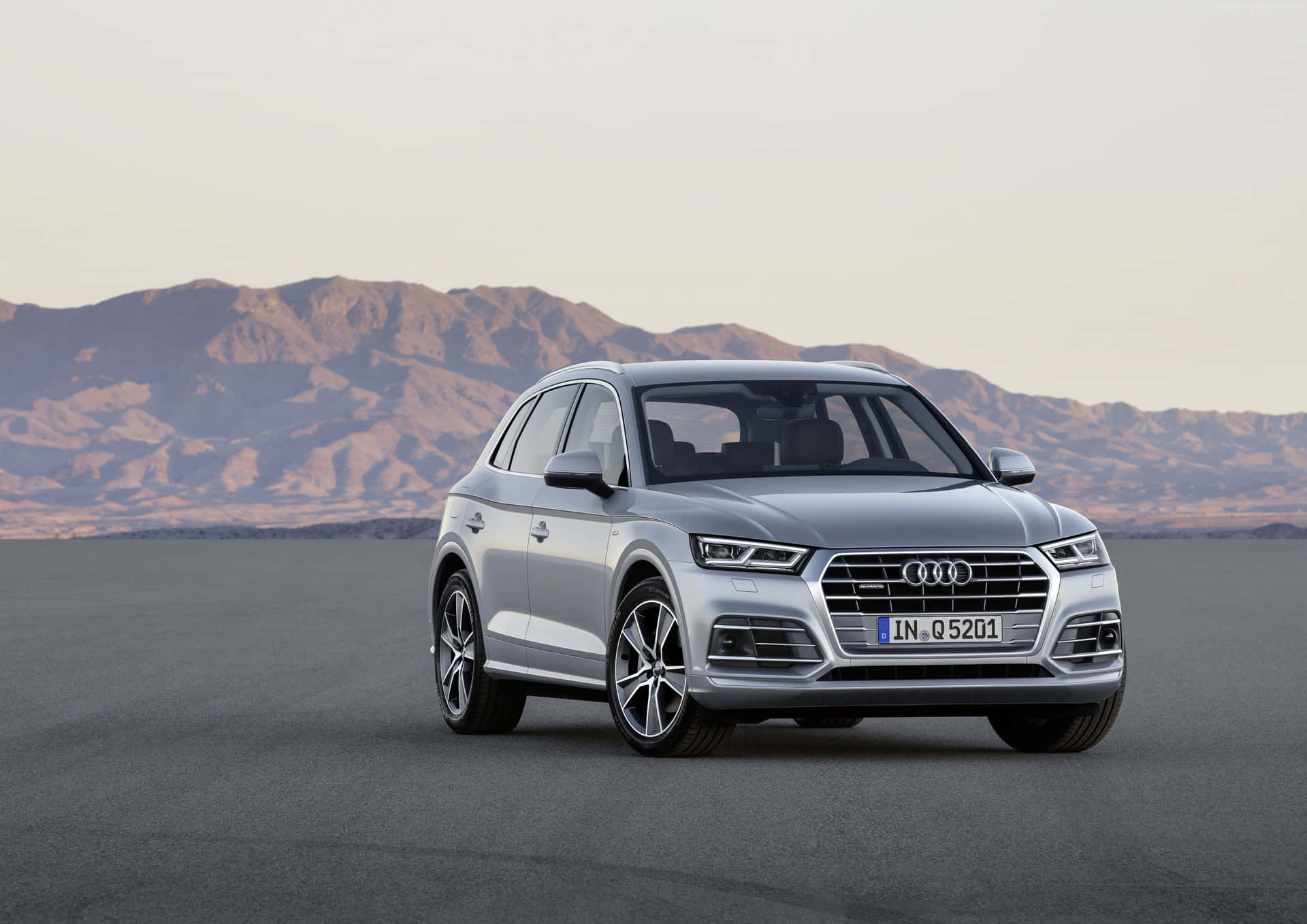 Audi Q5 - Driving on Open Road in Style Wallpaper