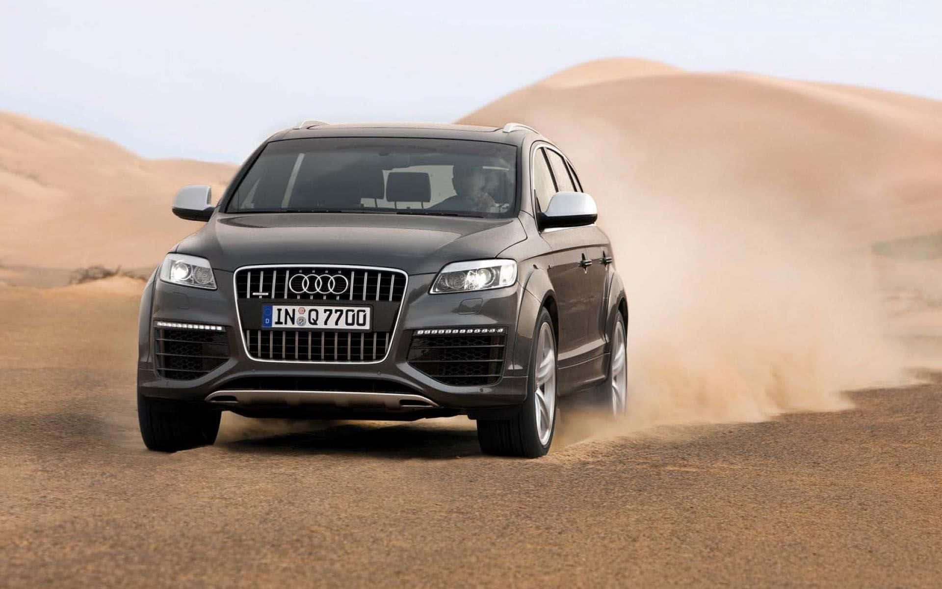 Stylish and captivating Audi Q7 on the road Wallpaper
