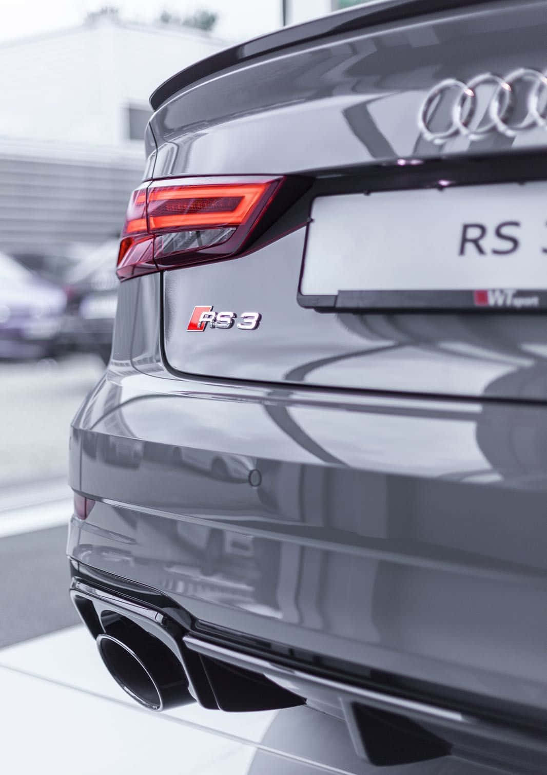 Caption: Audi RS3 - Dynamic Performance on the Road Wallpaper