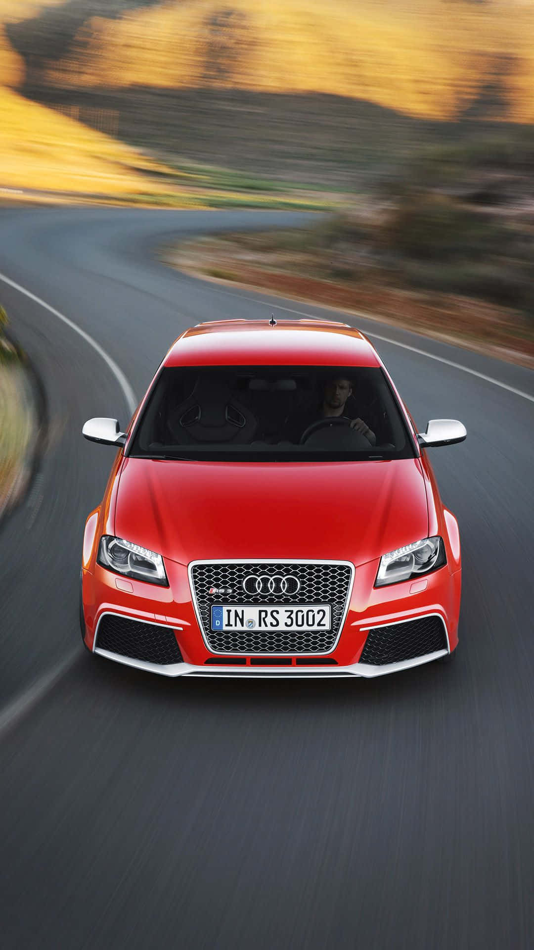 Sleek Audi RS3 on a City Road Wallpaper