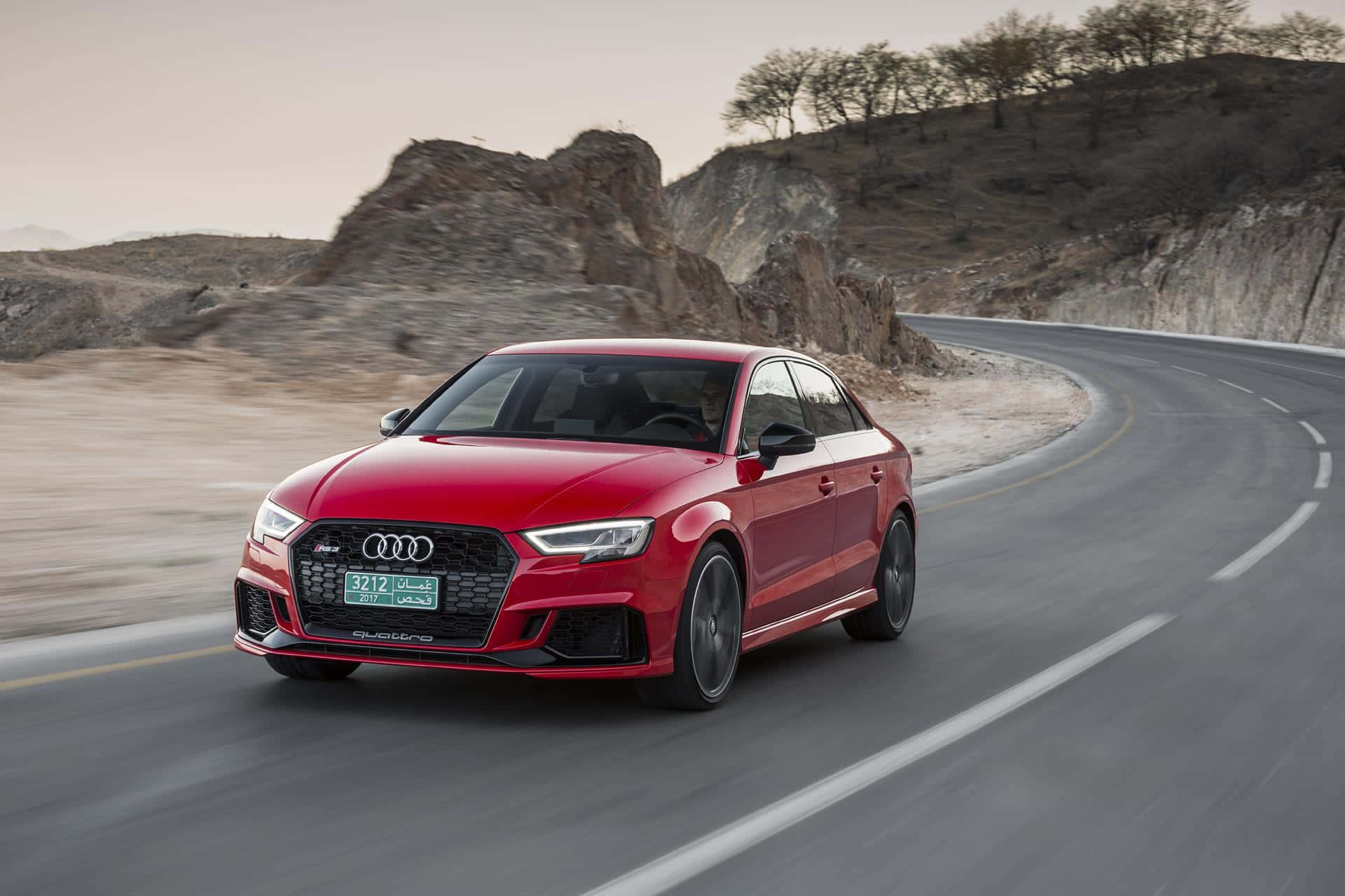 Sleek Audi RS3 on an Open Road Wallpaper