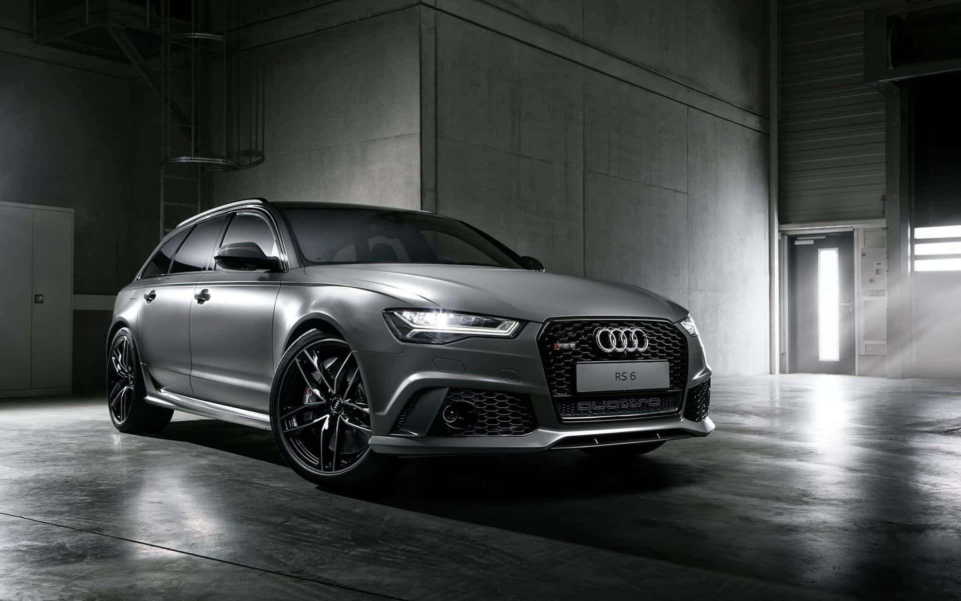 Sleek and Powerful Audi RS6 in Motion Wallpaper