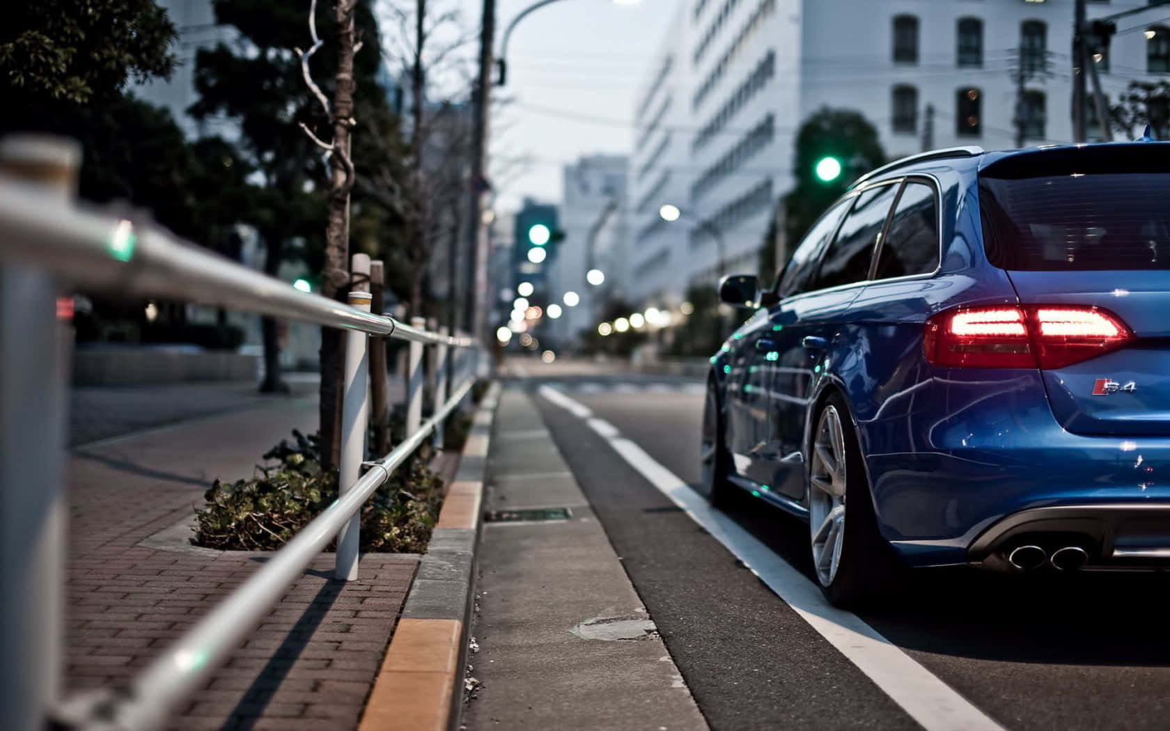 Caption: Stylish Audi S4 on a Scenic Drive Wallpaper