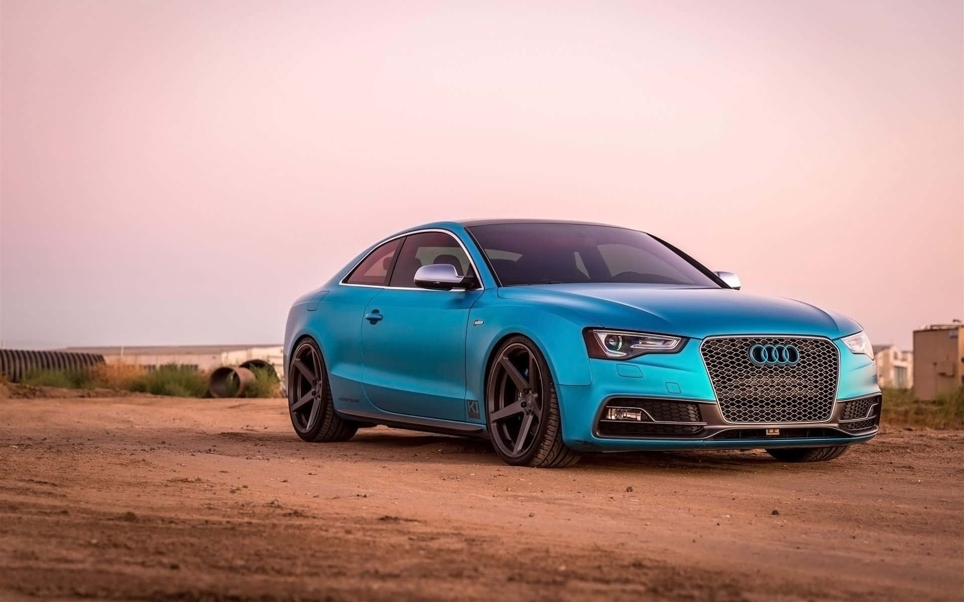 Stunning Audi S5 in action on a vibrant road Wallpaper