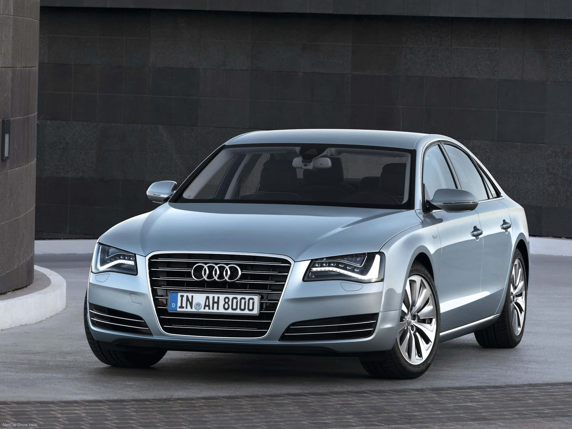 Sleek and sophisicated Audi S8 accelerating on an open road. Wallpaper