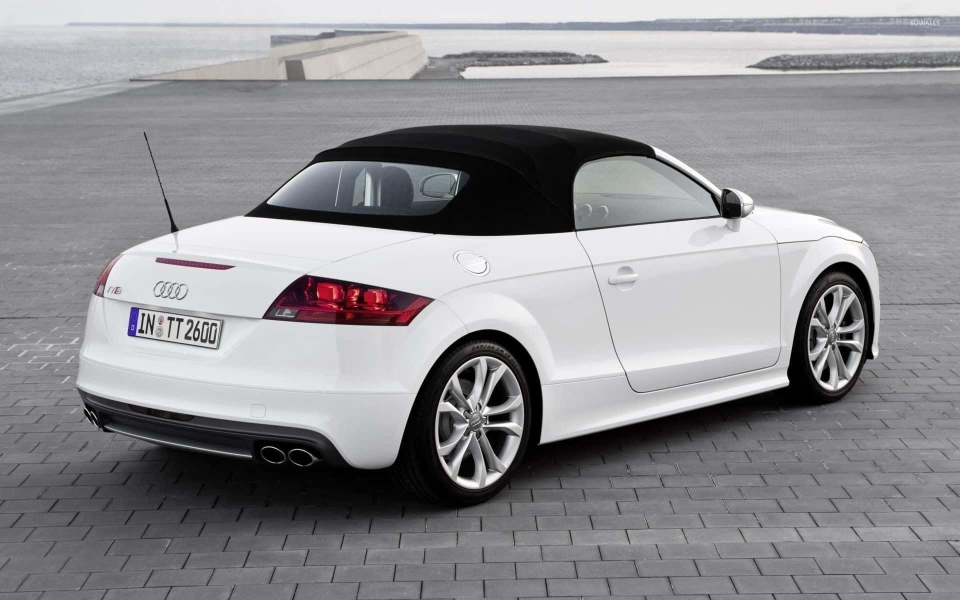 Audi TT Coupe Parked in Front of Modern Corporate Building Wallpaper
