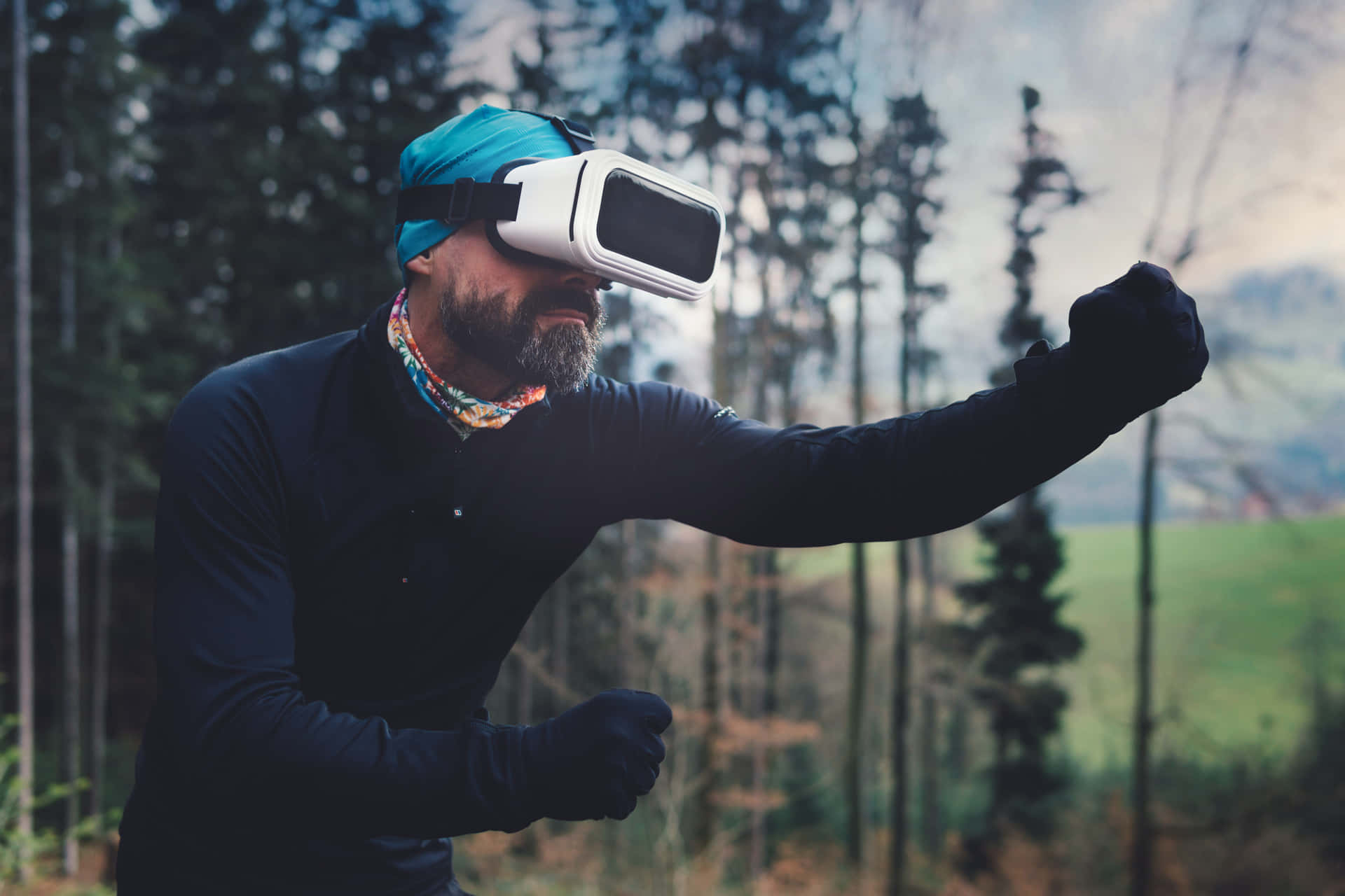 A Man Wearing A Virtual Reality Headset In The Forest Wallpaper