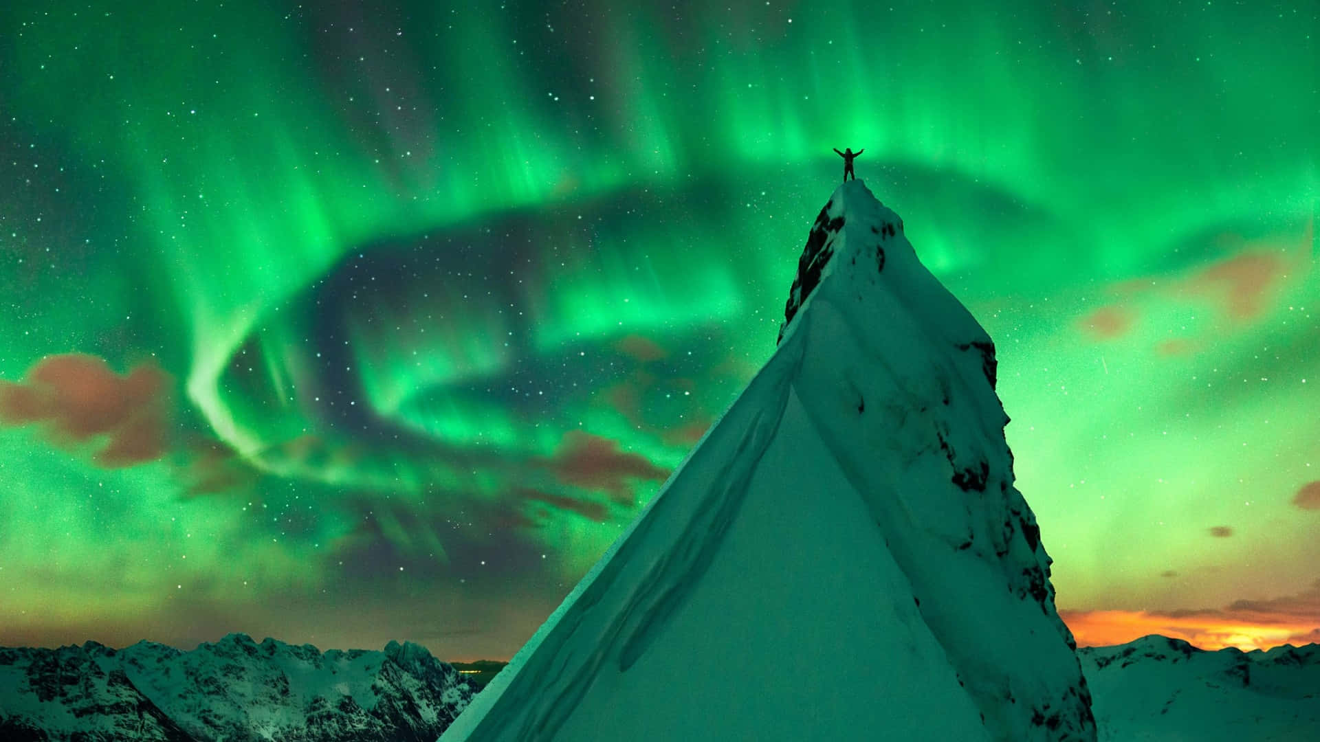 Majestic Aurora Borealis lighting up the night sky Wallpaper