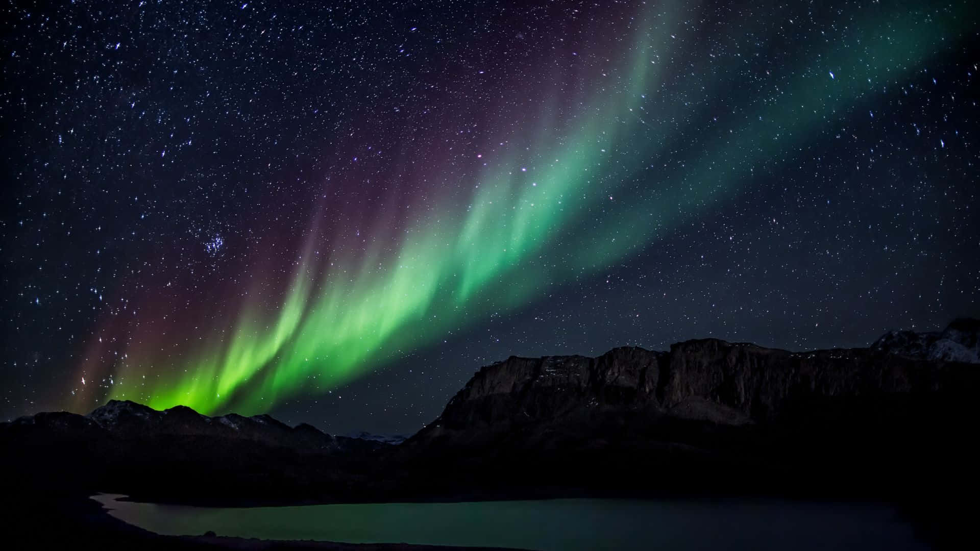 Spectacular Aurora Borealis illuminating the night sky Wallpaper