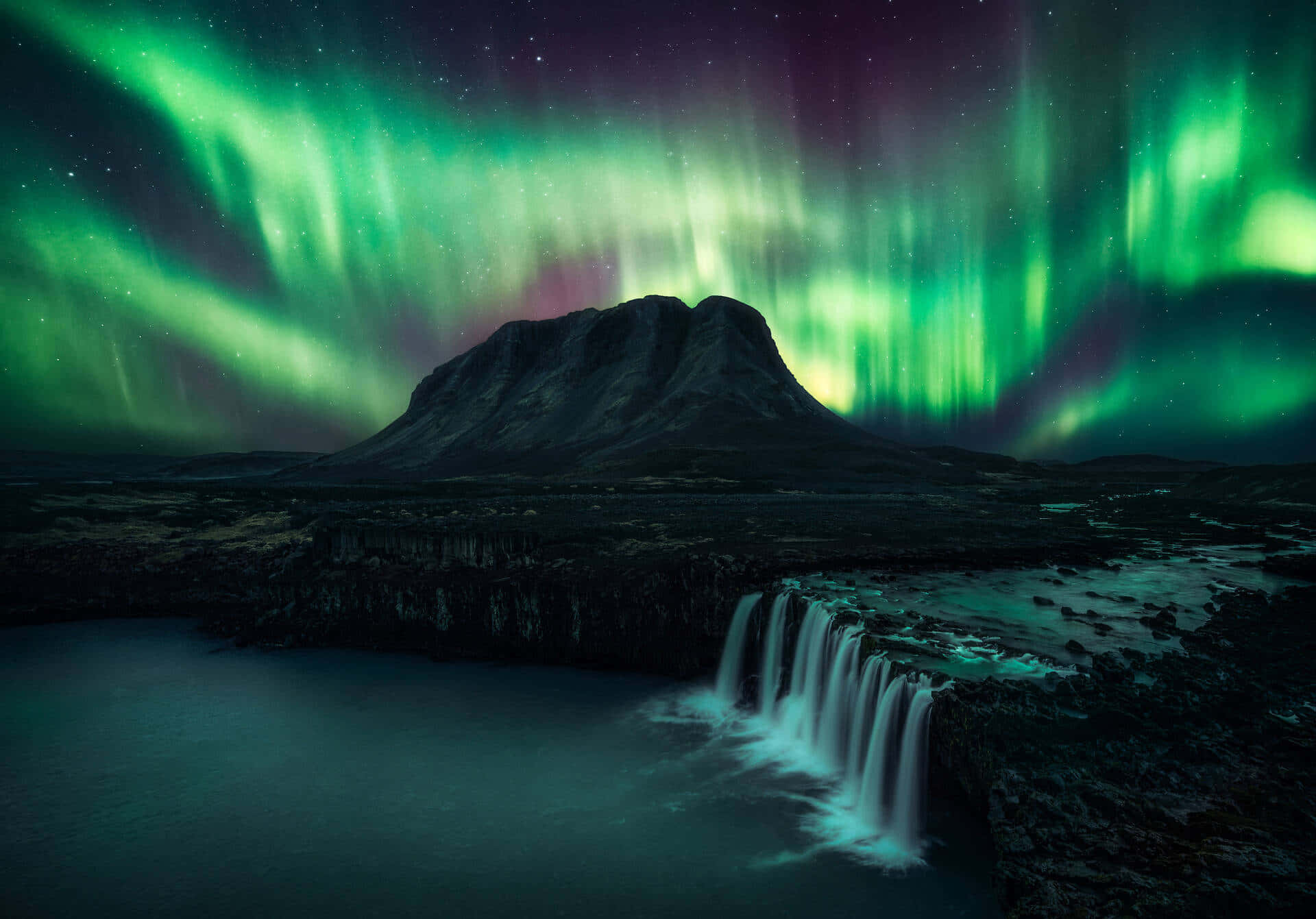 Stunning Aurora Borealis Dancing Across the Night Sky Wallpaper