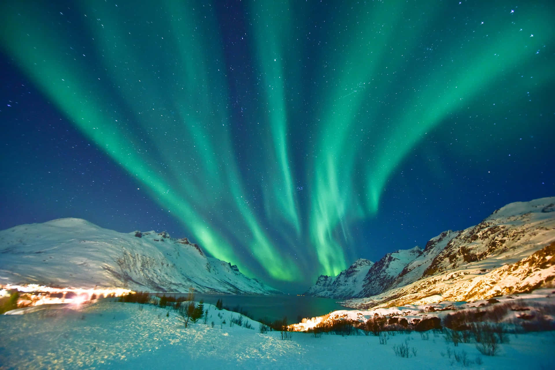 Spectacular Aurora Borealis Display in a Starry Night Sky Wallpaper