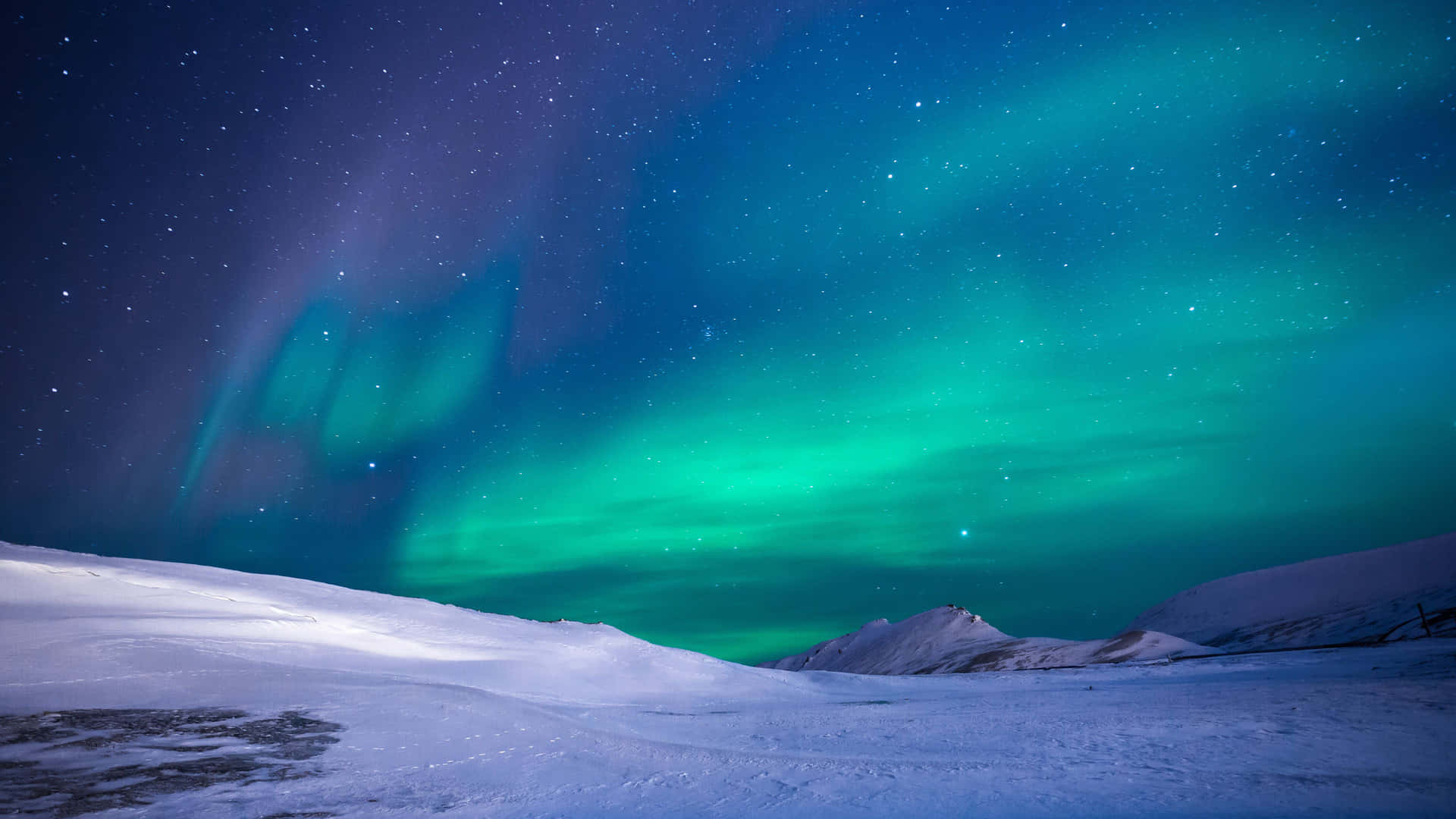 Aurora Borealis lights up the night sky in Northern Lapland.