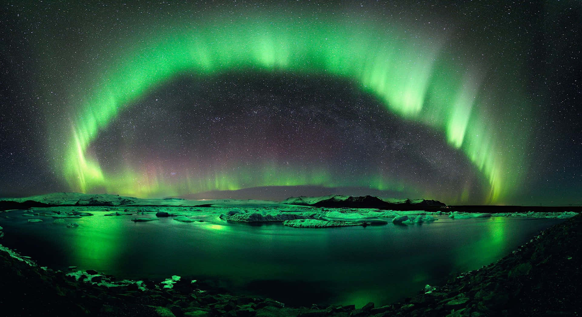 An Ethereal Aurora Mirrored In A Serene Lake
