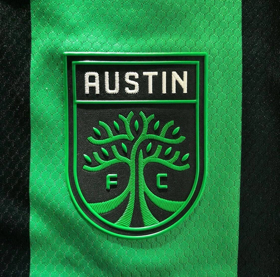 Austin FC Soccer Club Official Logo on Uniform Wallpaper