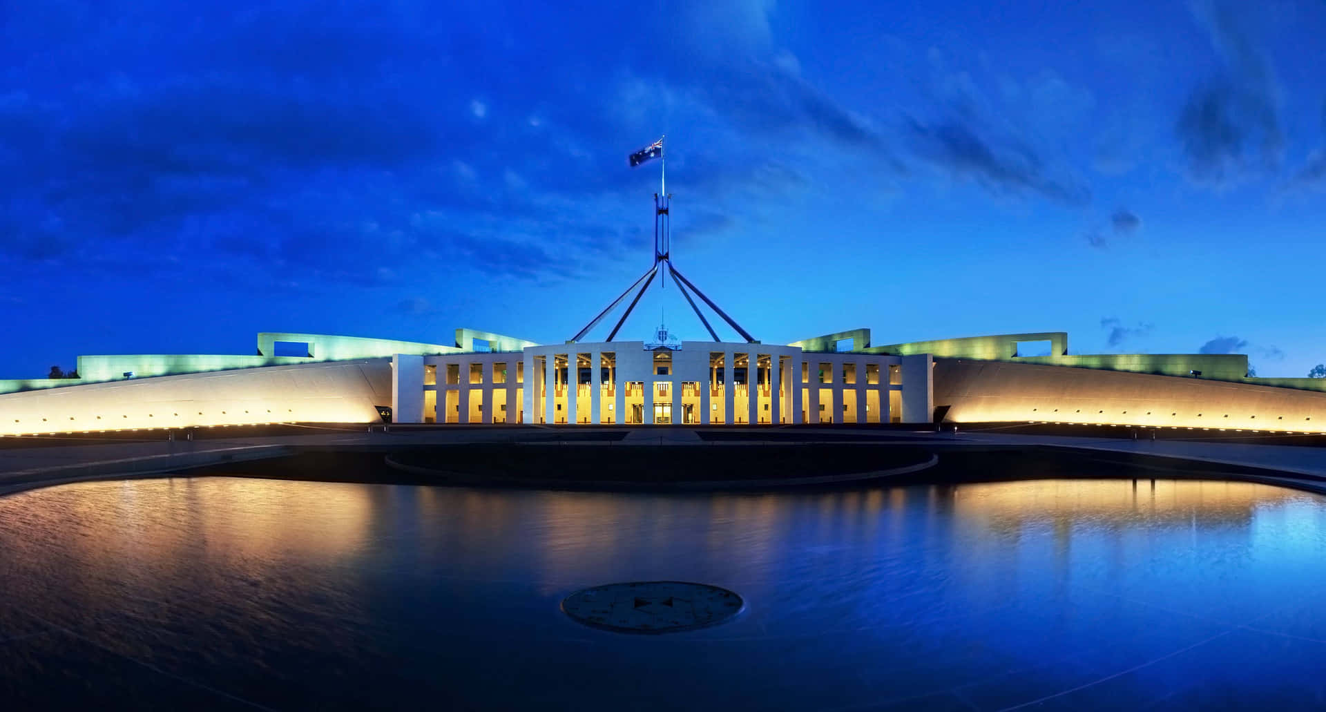 "The Parliament Buildings shine brightly at night in Canberra, Australia." Wallpaper