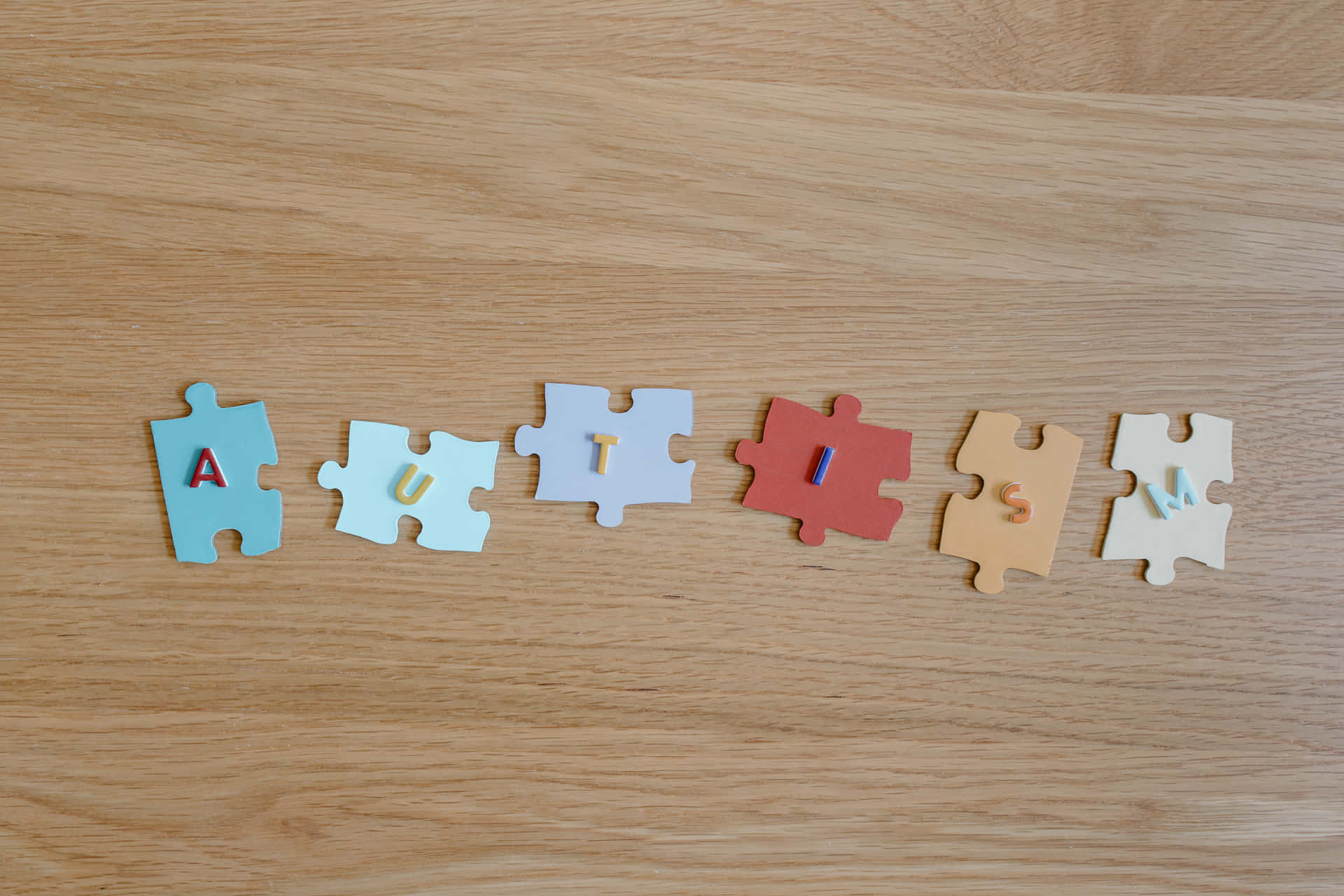 A Wooden Table With Puzzle Pieces