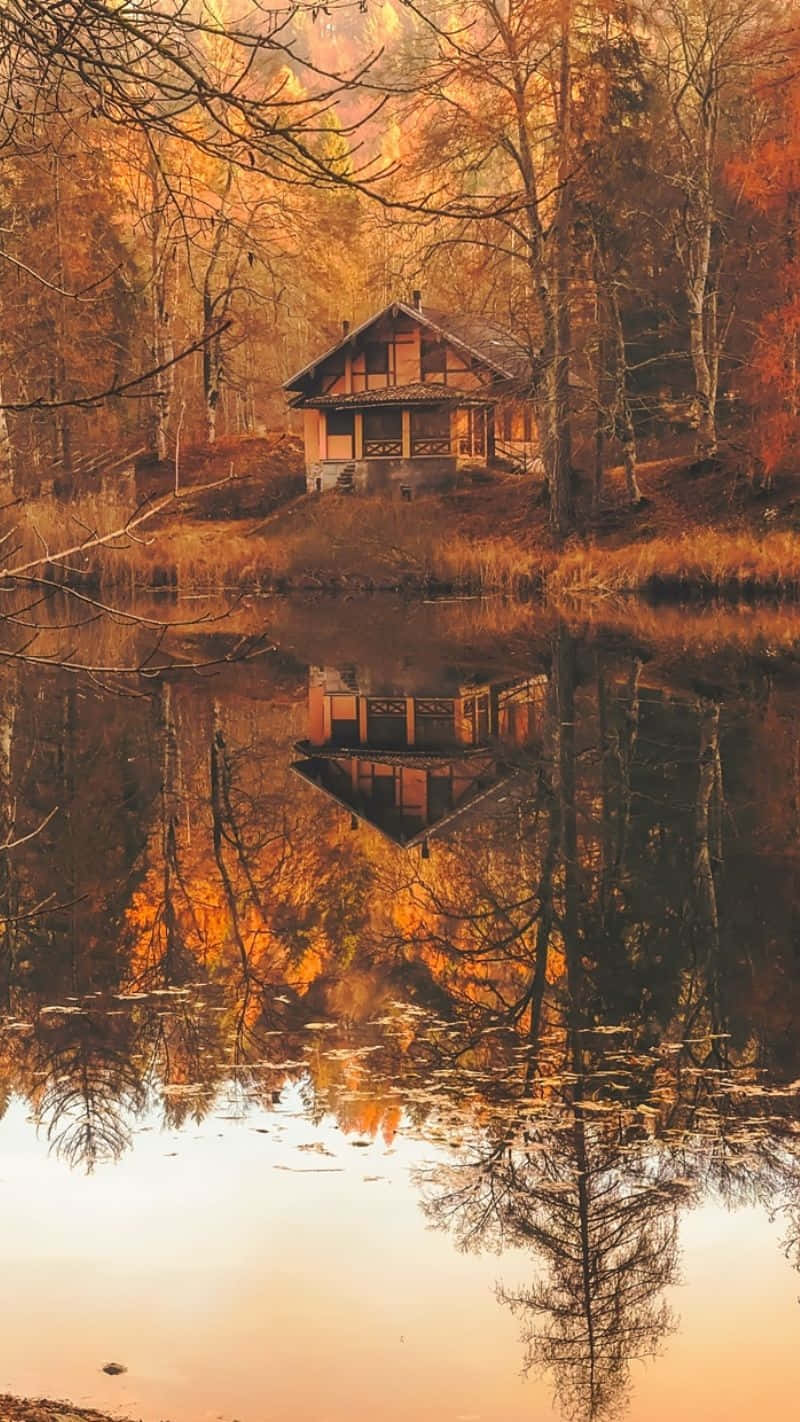 Autumnal Lakeside Cottage Reflection Wallpaper
