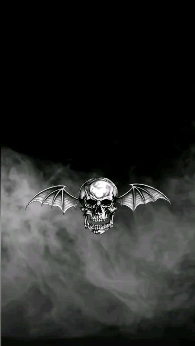 A Skull With Wings In The Background Wallpaper