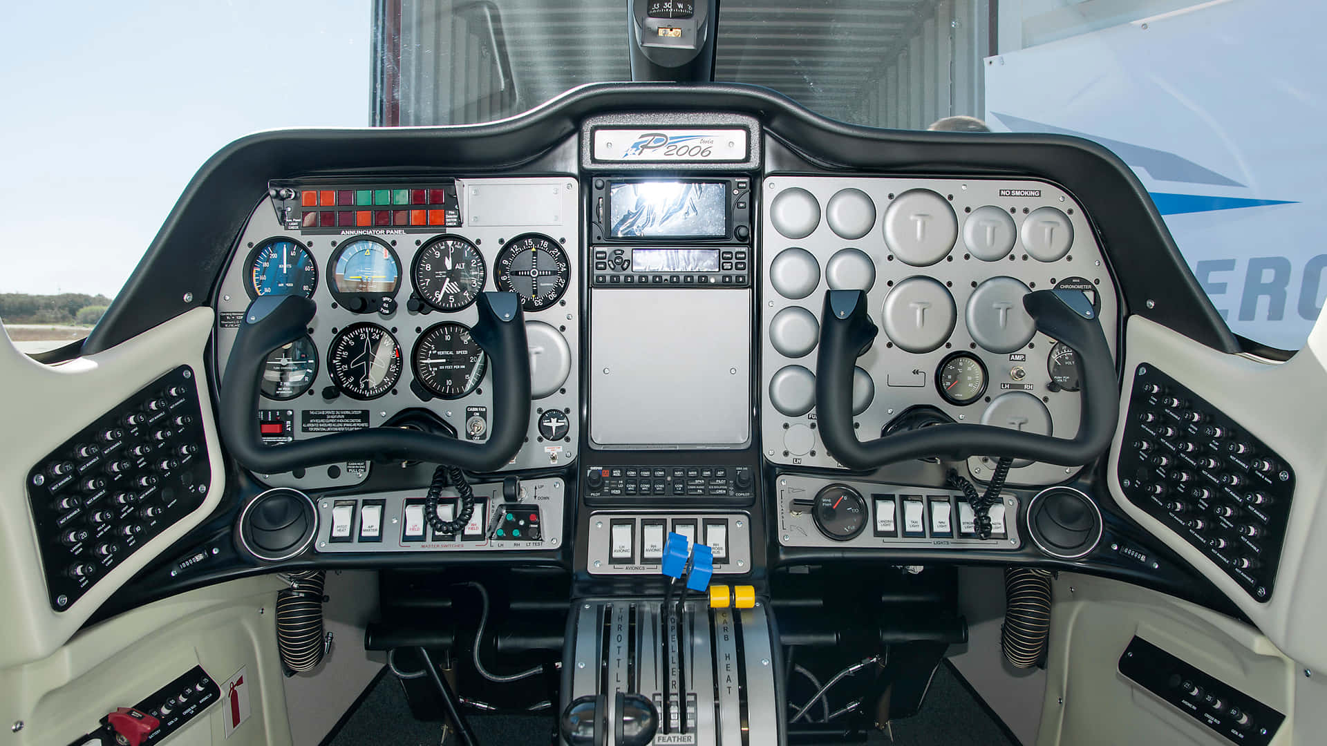 the cockpit of a helicopter with a large screen