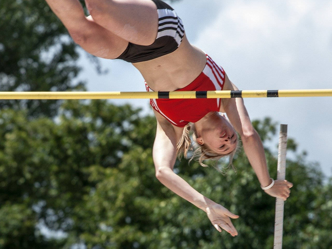 Awesome Female Pole Vault Athlete Wallpaper