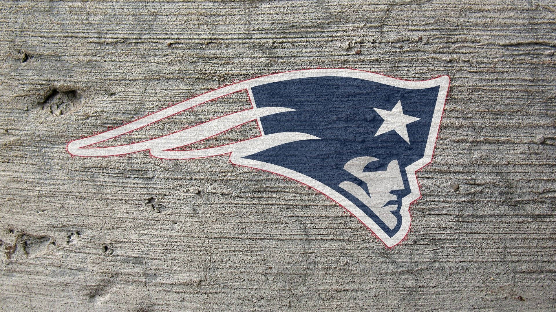 En ny New England Patriots klistermærke på en betonvæg. Wallpaper