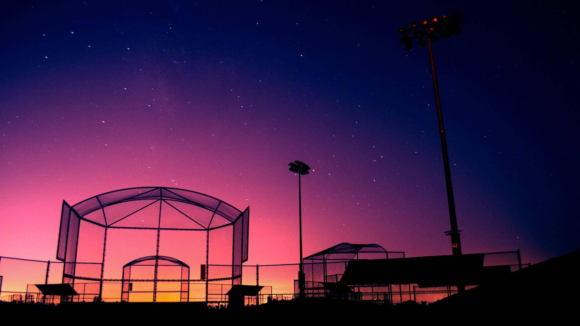 Awesome Softball Arena At Dusk Wallpaper