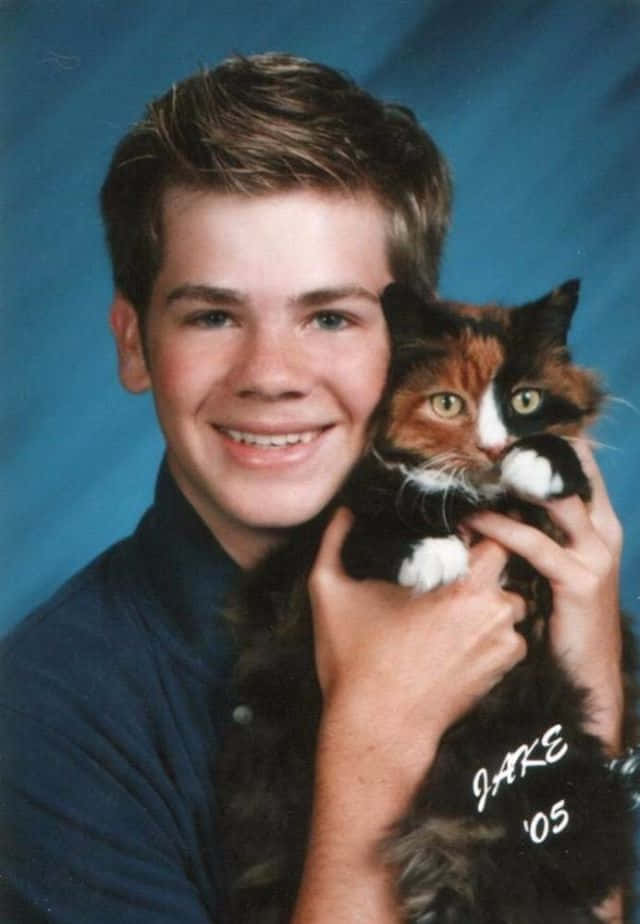 Awkward Boy With Cat Photoshoot Picture