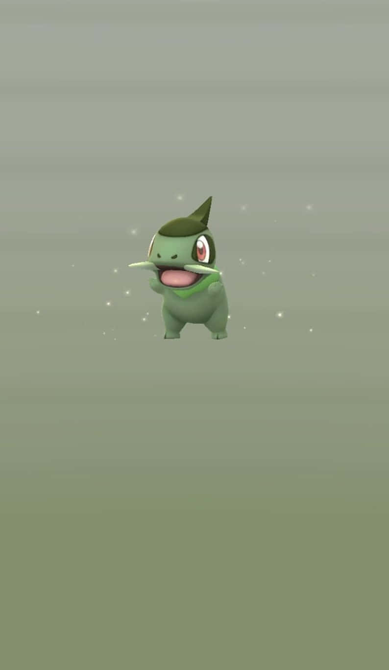 Axew, The Mighty Pokémon In Shimmering Green Fields Wallpaper
