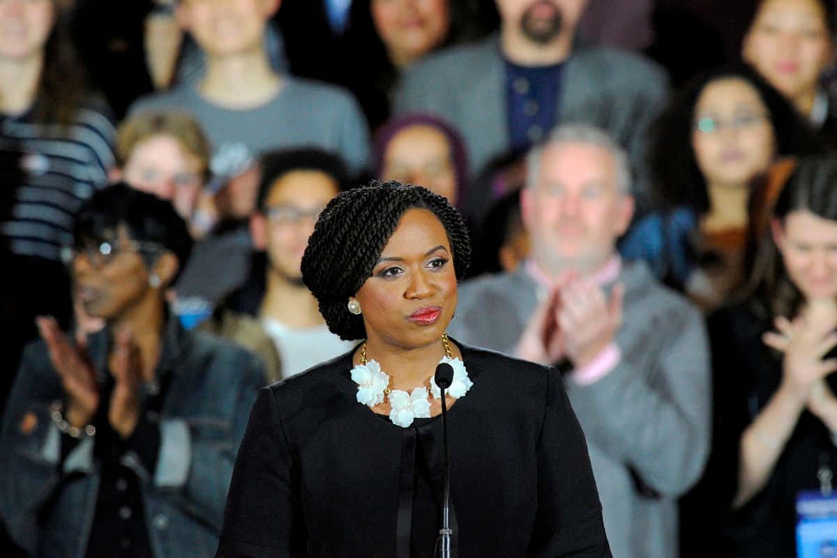 Ayanna Pressley Applauds Enthusiastically During Event Wallpaper