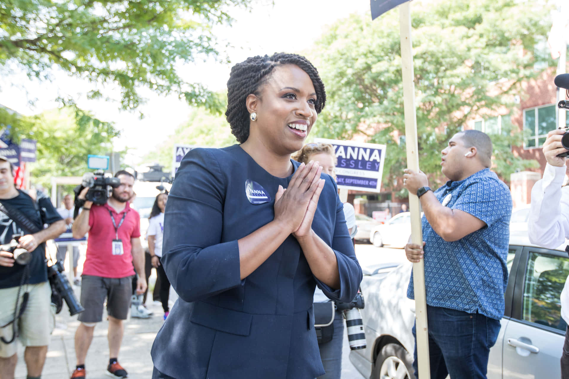 Ayanna Pressley Engaging with Public Business Outside Wallpaper