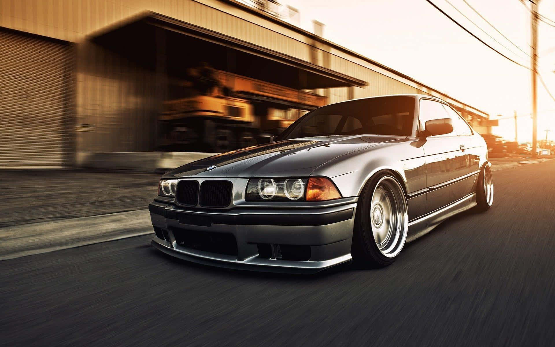 B M W E36 Coupe Speedingat Sunset Wallpaper