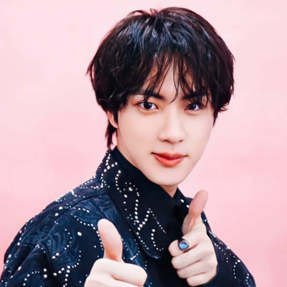 B T S Member Thumbs Up Pink Background Wallpaper