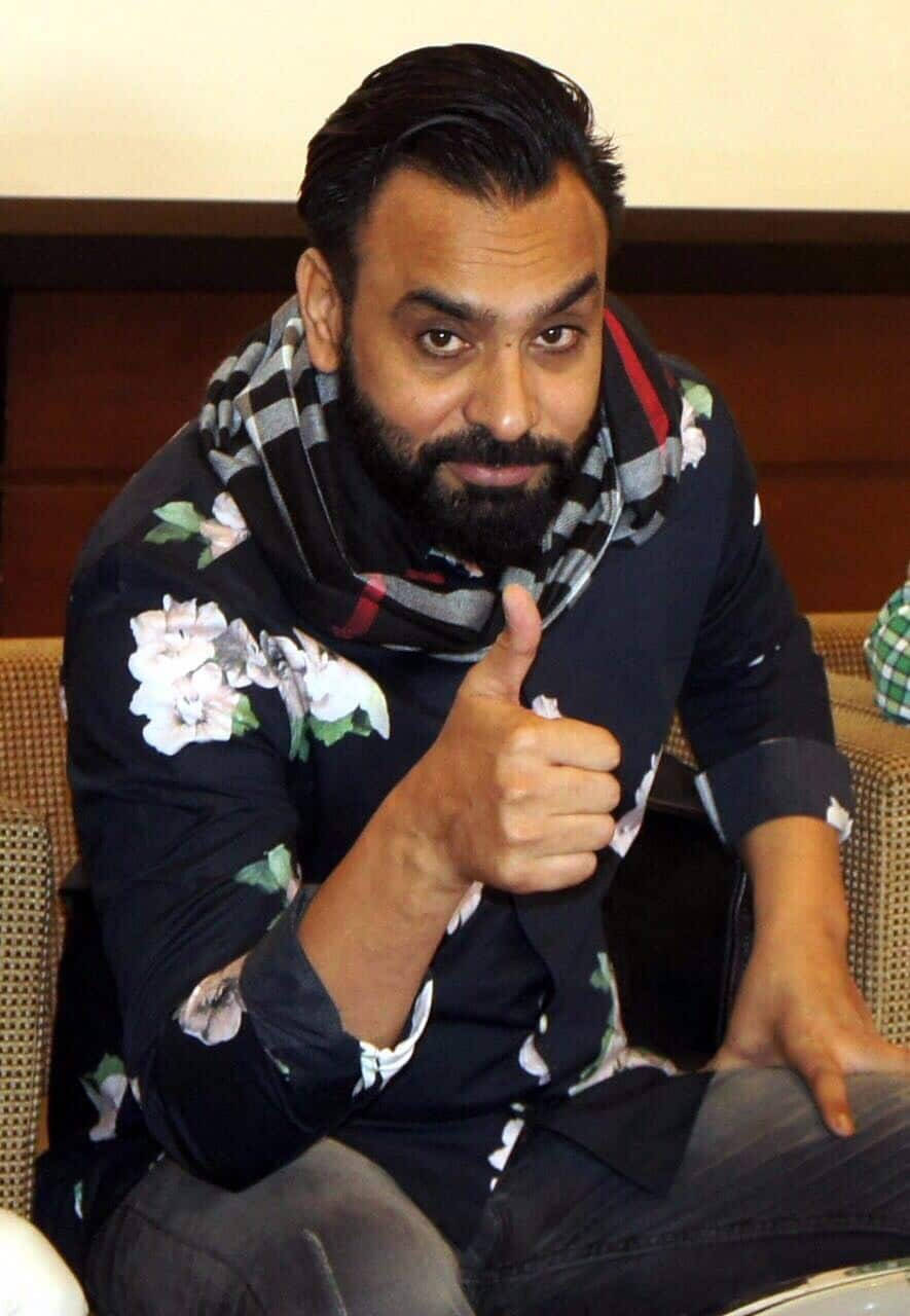 Download Babbu Maan With A Thumbs Up Wallpaper 