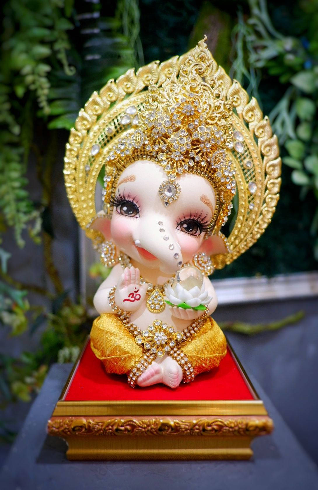 Download Baby Ganesh White Lotus Wallpaper | Wallpapers.com