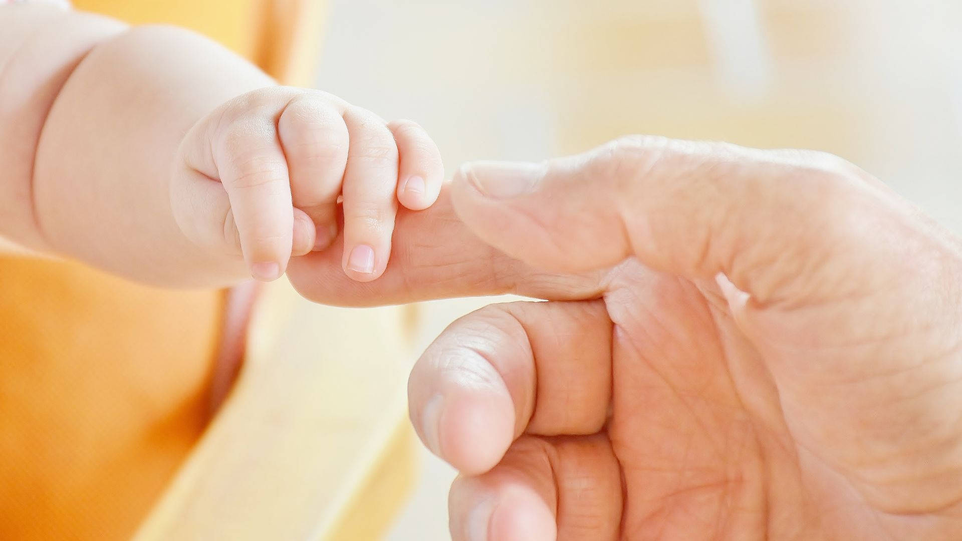 Baby Hand Reaching For Parent's Hand Wallpaper
