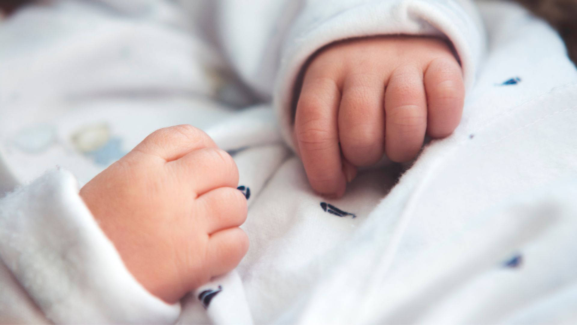Baby Hands Wearing White Outfit Wallpaper