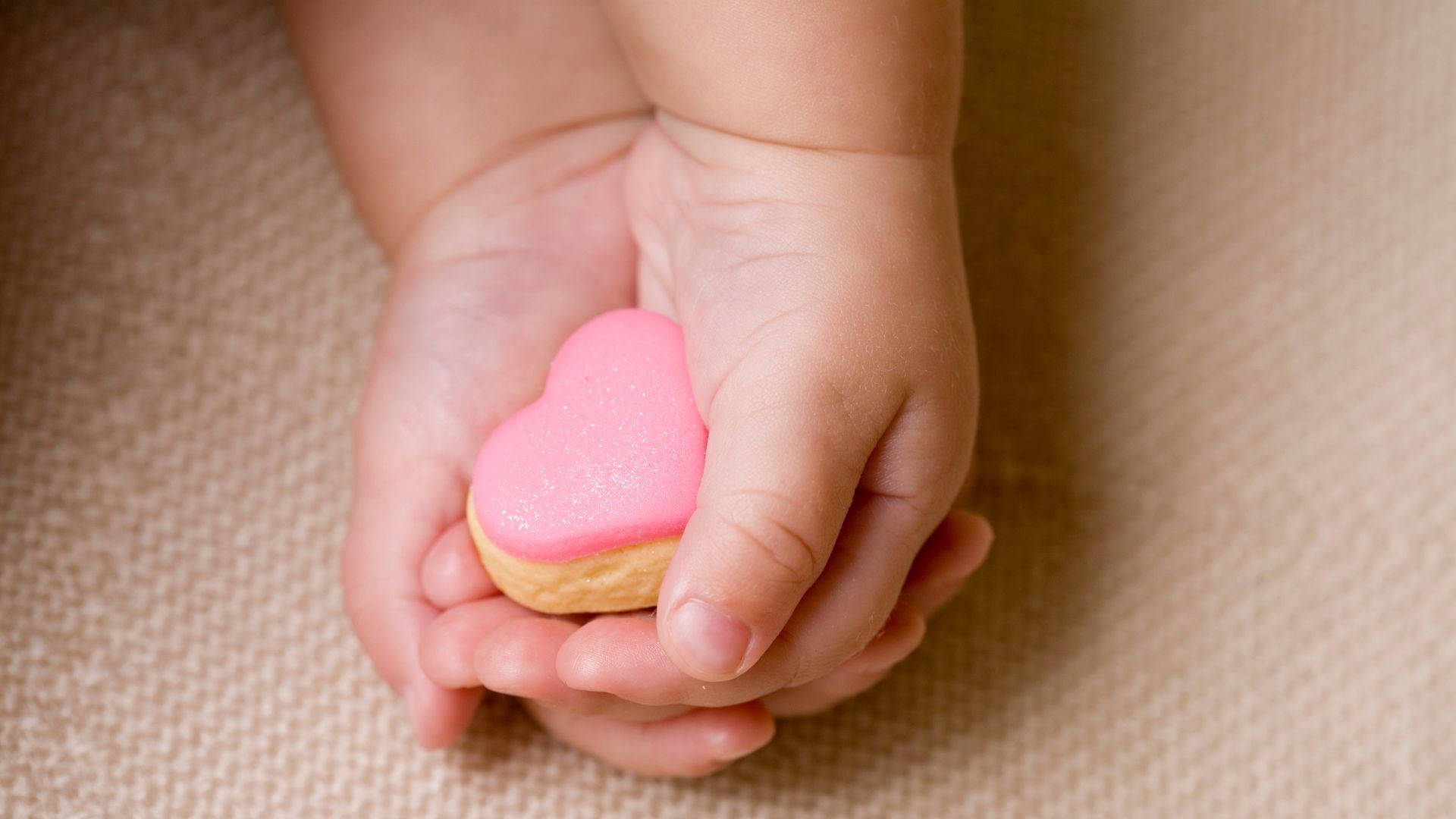 Baby Hands With A Pink Heart Wallpaper