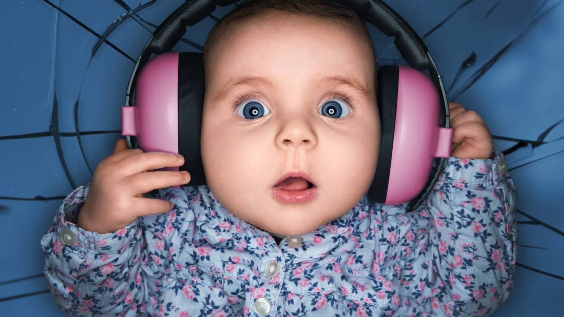 Baby Love Wearing Headphones Wallpaper