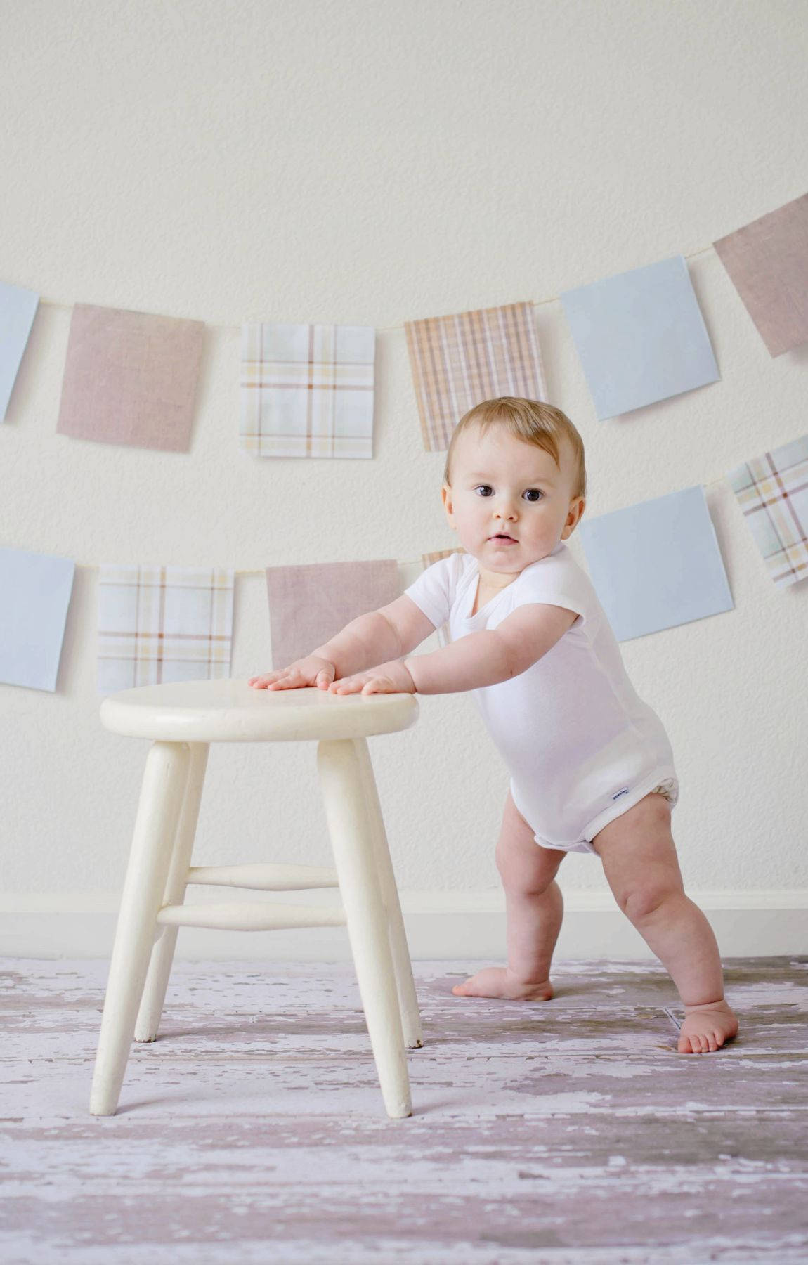Baby Photography Posing With A Stool Wallpaper