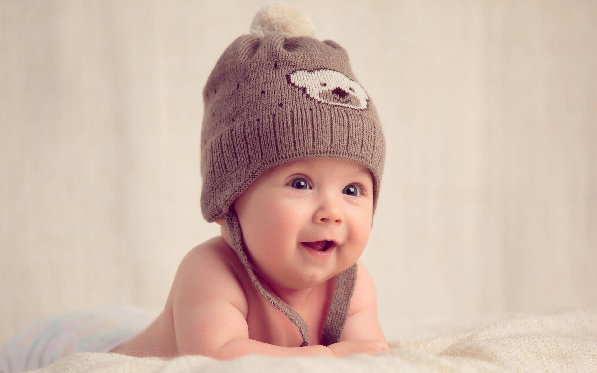Baby Photography Wearing Brown Bonnet Wallpaper