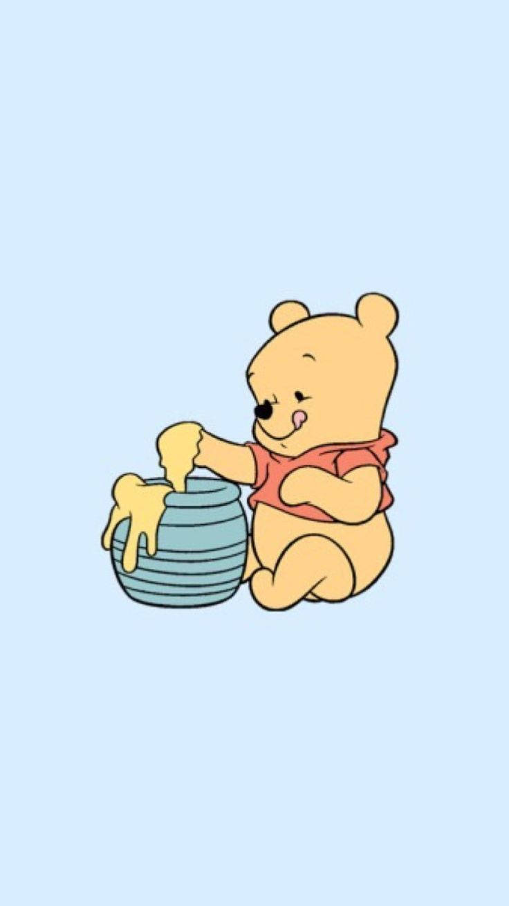 Little Winnie The Pooh has finally gotten his hands on a pot of honey! Wallpaper