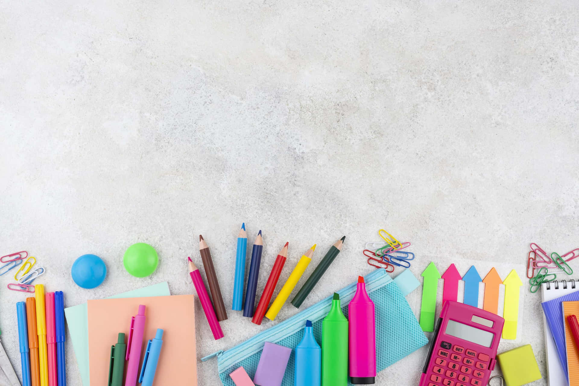 Colorful School Supplies On A Concrete Background