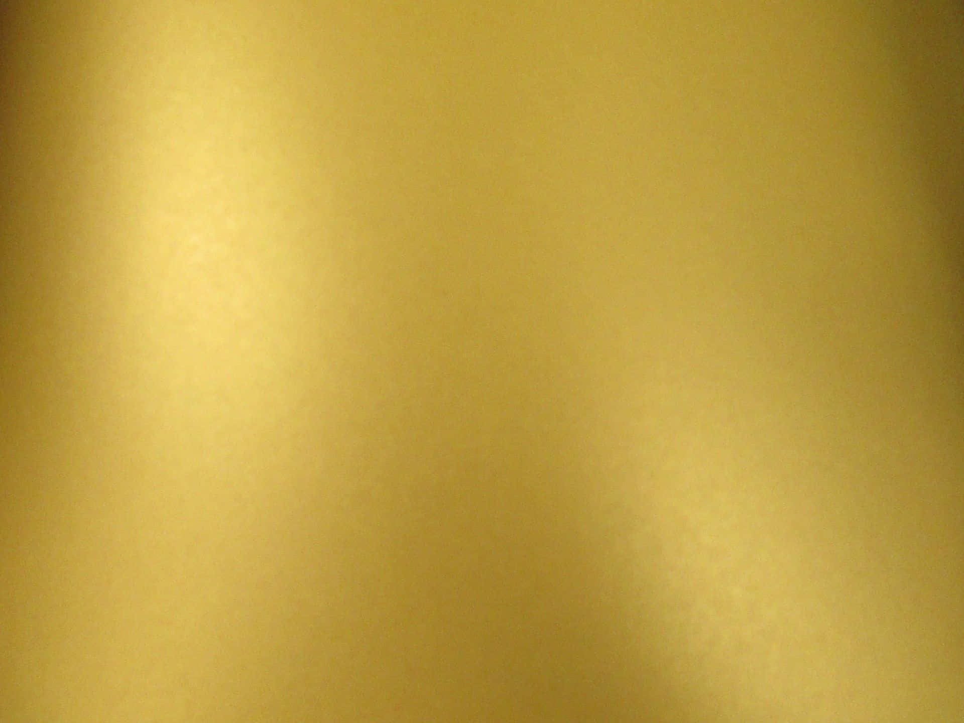 A Gold Colored Background With A White Background