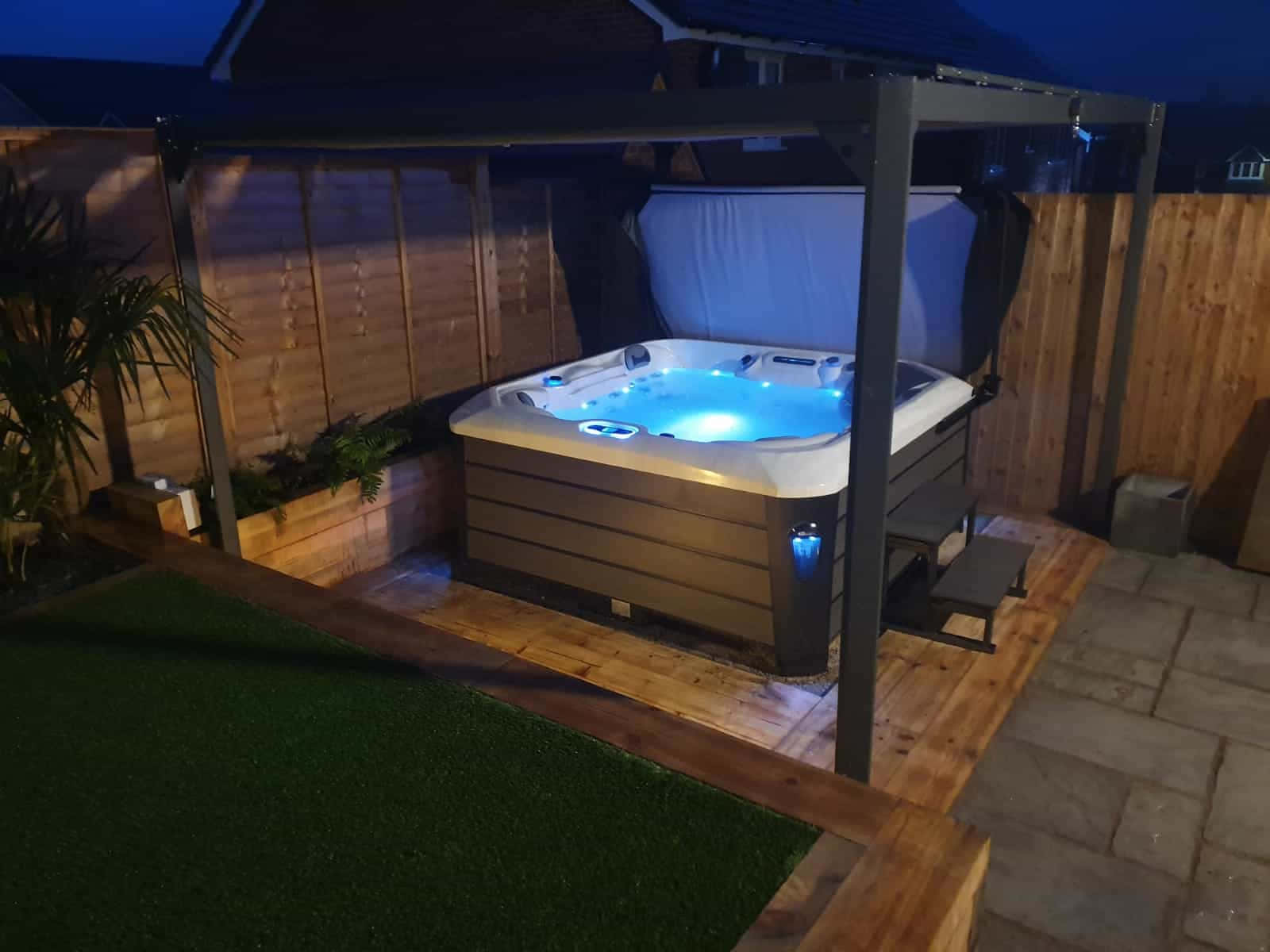 Backyard Hot Tub Nighttime Setting Wallpaper