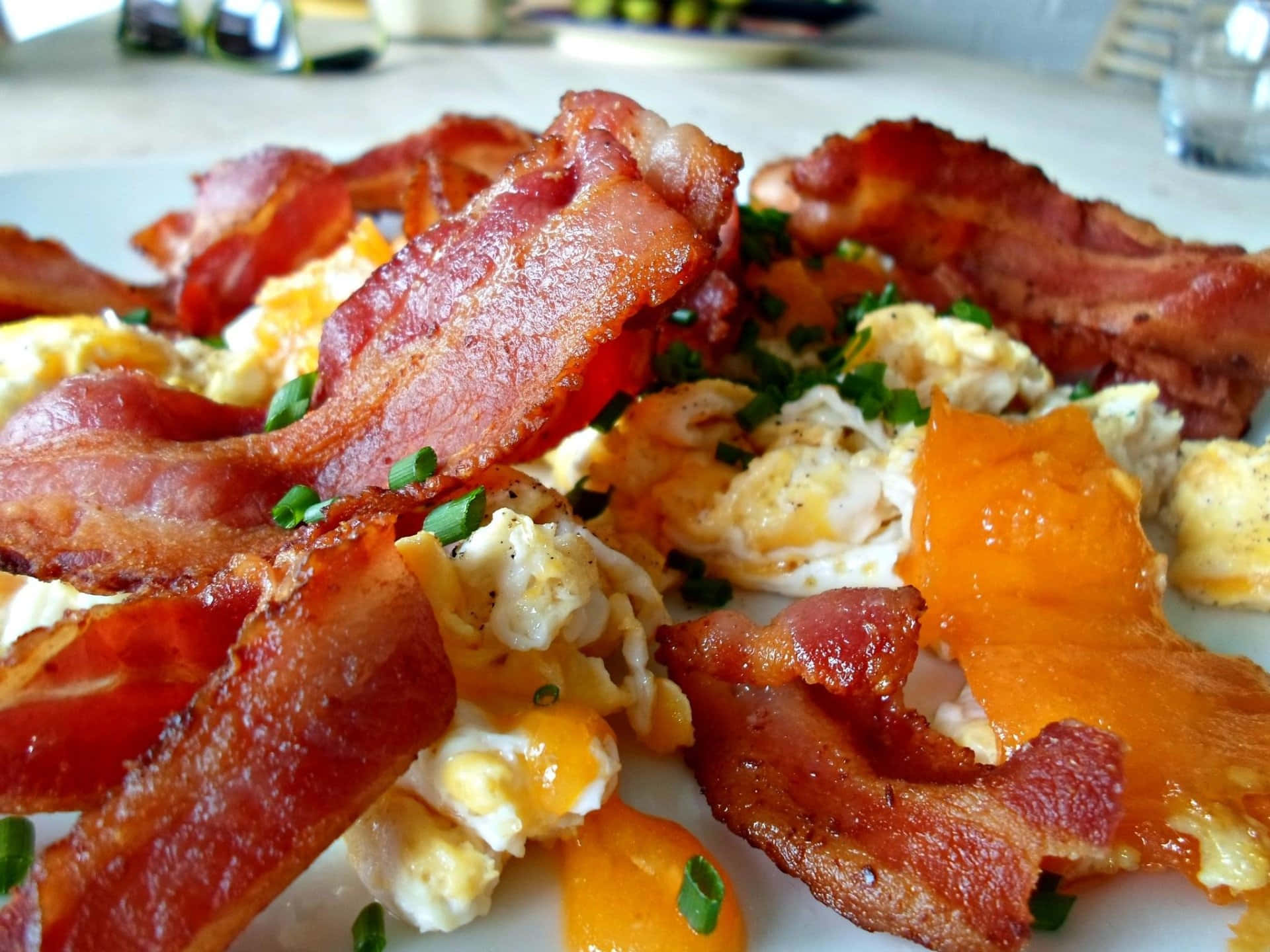 A Plate Of Bacon, Eggs And Oranges