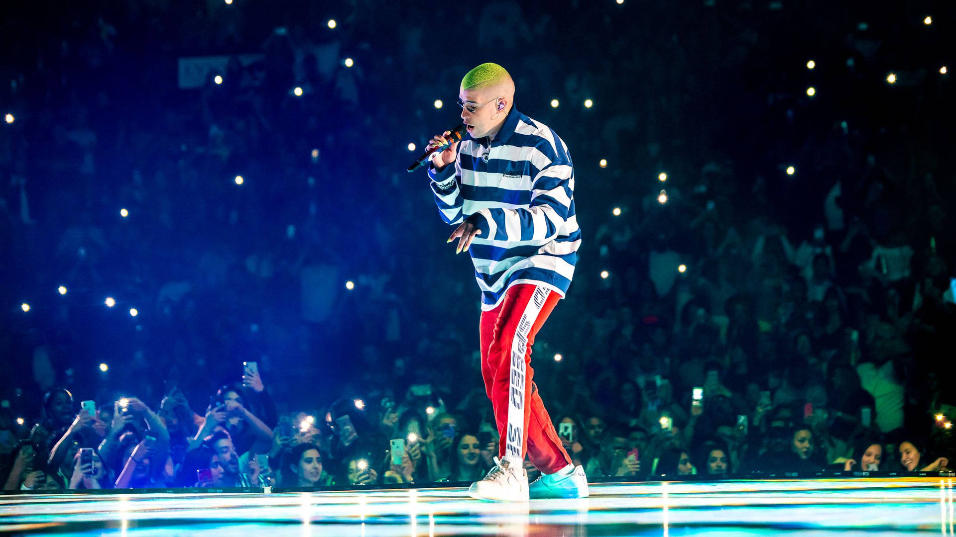 Bad Bunny On Stage With Fans Wallpaper