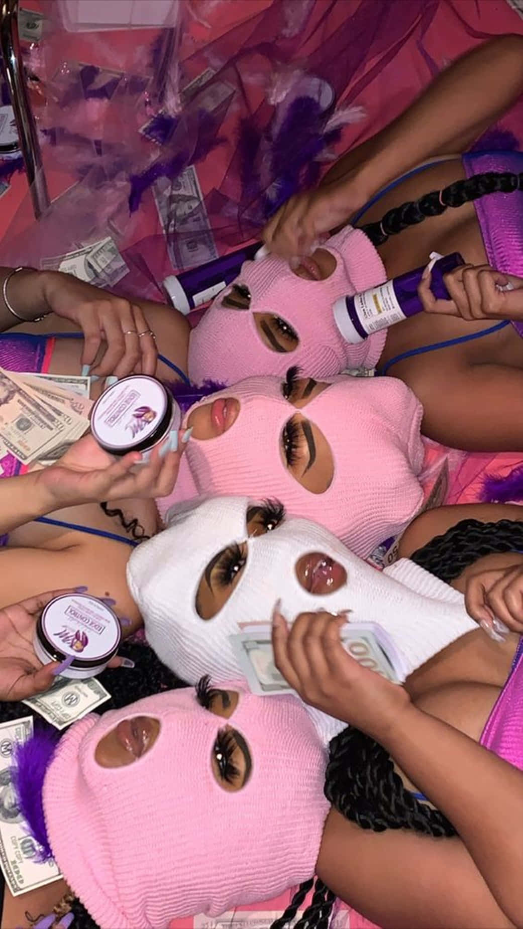 A Group Of Women With Masks And Money On Their Heads Wallpaper